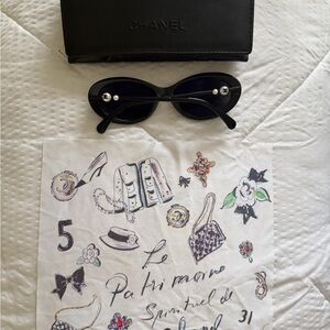 CHANEL Black Oval Sunglasses with Pearl Temple Detail